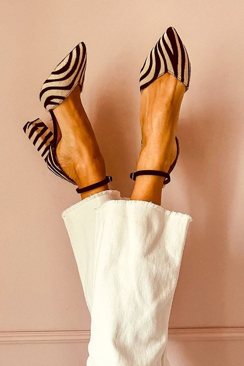Women's zebra print medium-heel sandals with ankle strap, offering stylish comfort for summer.