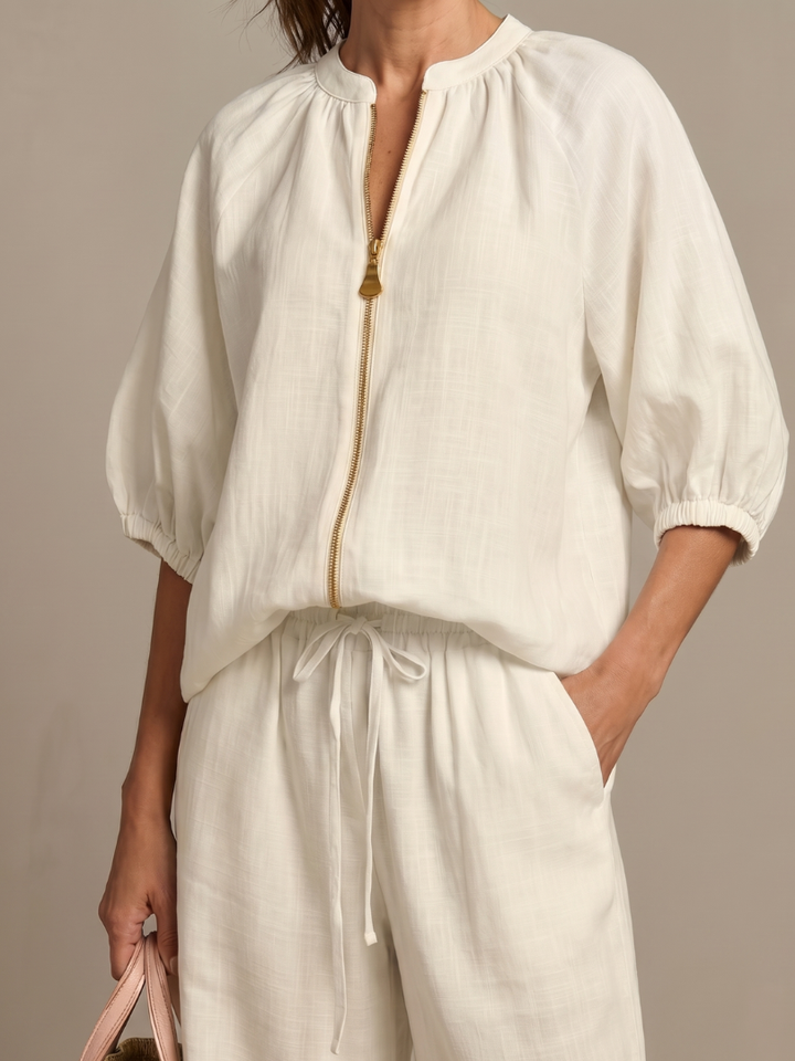 Women's casual two-piece set: zip front blouson top & comfortable wide leg pants ensemble.