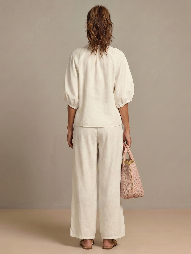 Elegant women's matching set with a zip front blouson top & chic wide leg pants.