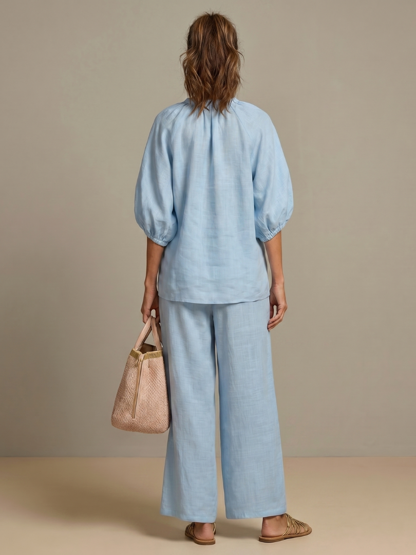 Comfortable & chic women's matching set: zip front blouson top and wide leg pants.