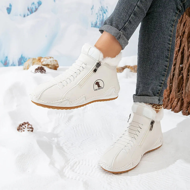 Cozy faux-fur lined women's zip-up winter boots, offering warmth and a comfortable wide fit.
