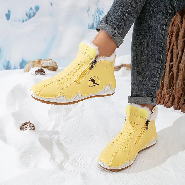 Women's warm footwear: faux-fur lined zip-up ankle boots with a comfortable wide fit.