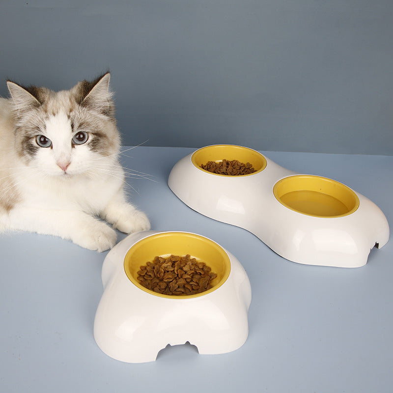 Yellow non-slip double pet feeding bowl set for dogs & cats. Durable, easy-clean food & water station.