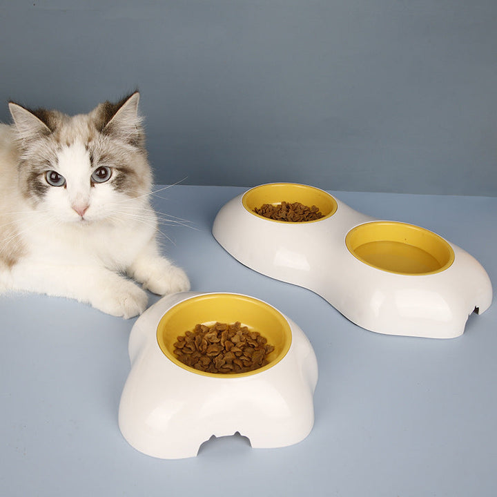 Yellow non-slip double pet feeding bowl set for dogs & cats. Durable, easy-clean food & water station.