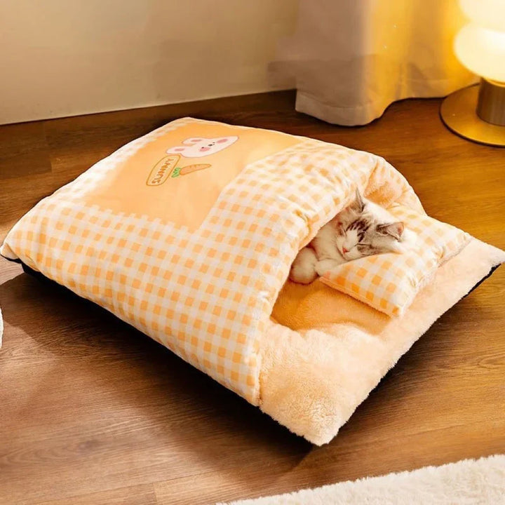 Washable green plush cat sleeping bag, a cozy and secure pet bed for cats.