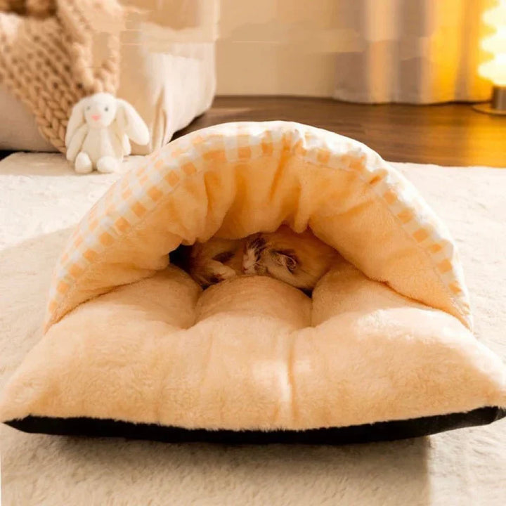 Plush cat sleeping bag bed in yellow, providing a secure and cozy hideaway for pets.