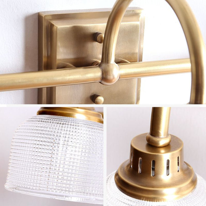 Elegant antique brass bedroom wall light, hardwired indoor lamp with a beautiful glass shade.
