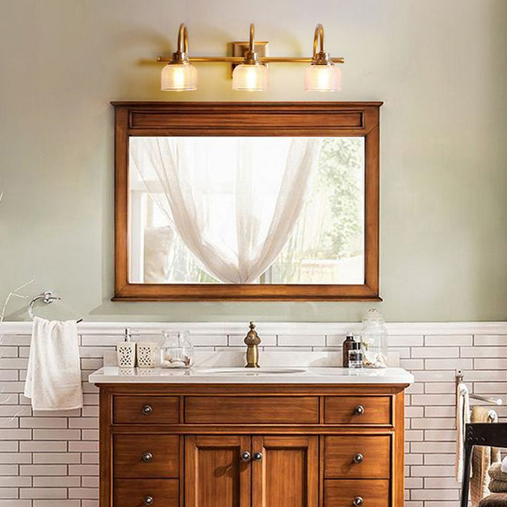 Antique brass vanity light for bathroom, hardwired indoor wall lamp with glass shade.