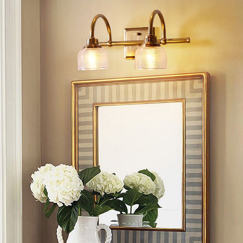 Modern classic antique brass wall light, ideal for bedroom or living room elegant lighting.